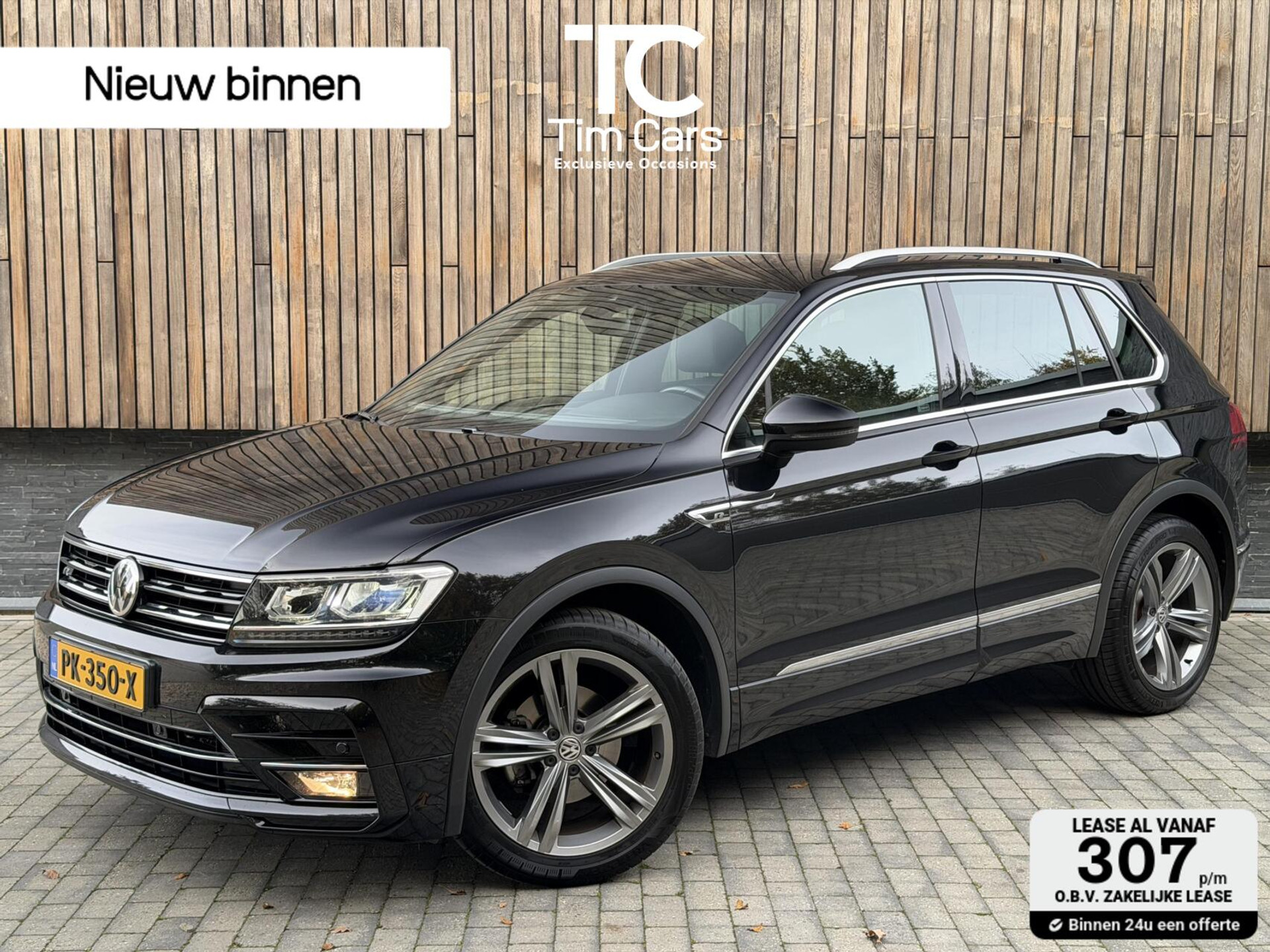 Volkswagen Tiguan 1.4 TSI R-line Handgeschakeld | Half/leer | R-line stuurwiel | LED verlichting | Stoelverwarming | Zwarte hemelbekleding | Apple CarPlay | Adaptieve cruise control | Parkeersensoren voor en achter 49039395-0.jpg | Timcars.nl